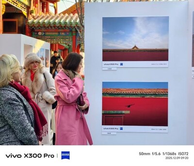 The diplomats present lingered to view the photographic works presented The diplomats present lingered to view the photographic works presented